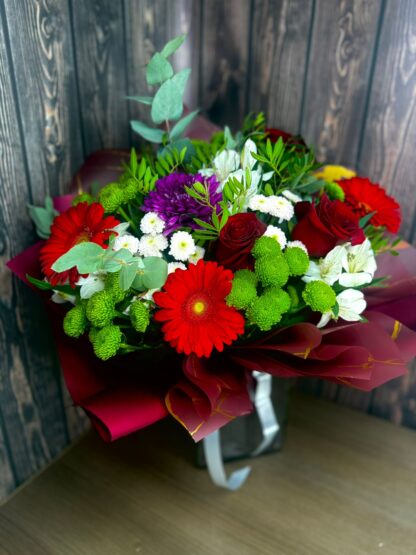 Bright Bouquet with Chrysanthemums, Red Gerberas, Alstroemeria, Eucalyptus, and Red Roses – A Bold Gift with Character