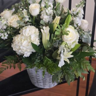Basket bouquet: white hydrangea, lily, rose, stock